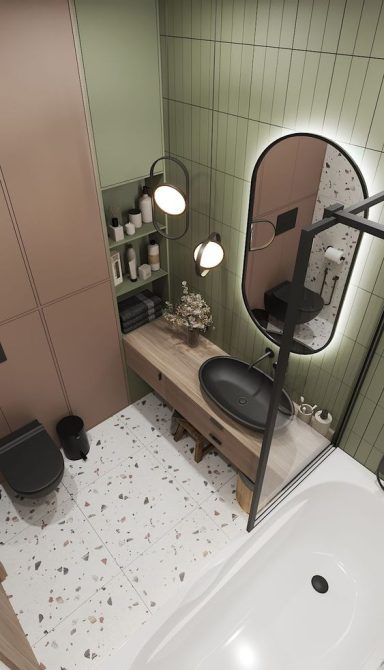 Salle de bain moderne avec des murs vert olive, baignoire et meuble en bois.
