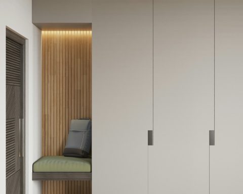 Espace intérieur minimaliste avec des placards et un coin repos chaleureux.
