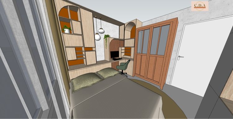 Intérieur d'une pièce avec un bureau, deux coussins et une porte en bois.