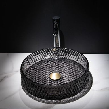 Lavabo en noir avec robinet, design moderne en forme de cercle, élégant et épuré.